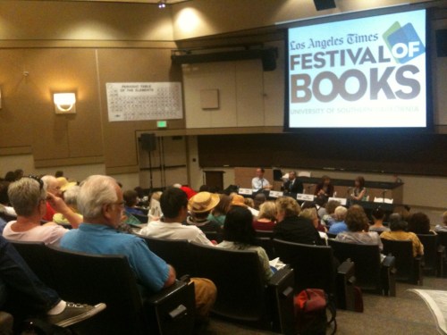 Second author from the right, burgundy sweater.